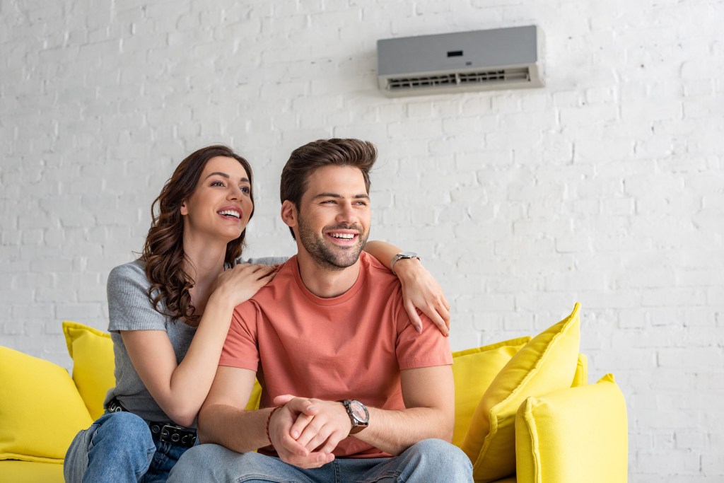 Man and wife happy because their AC Unit works now